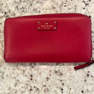 Kate Spade New York large zip around wallet. Red